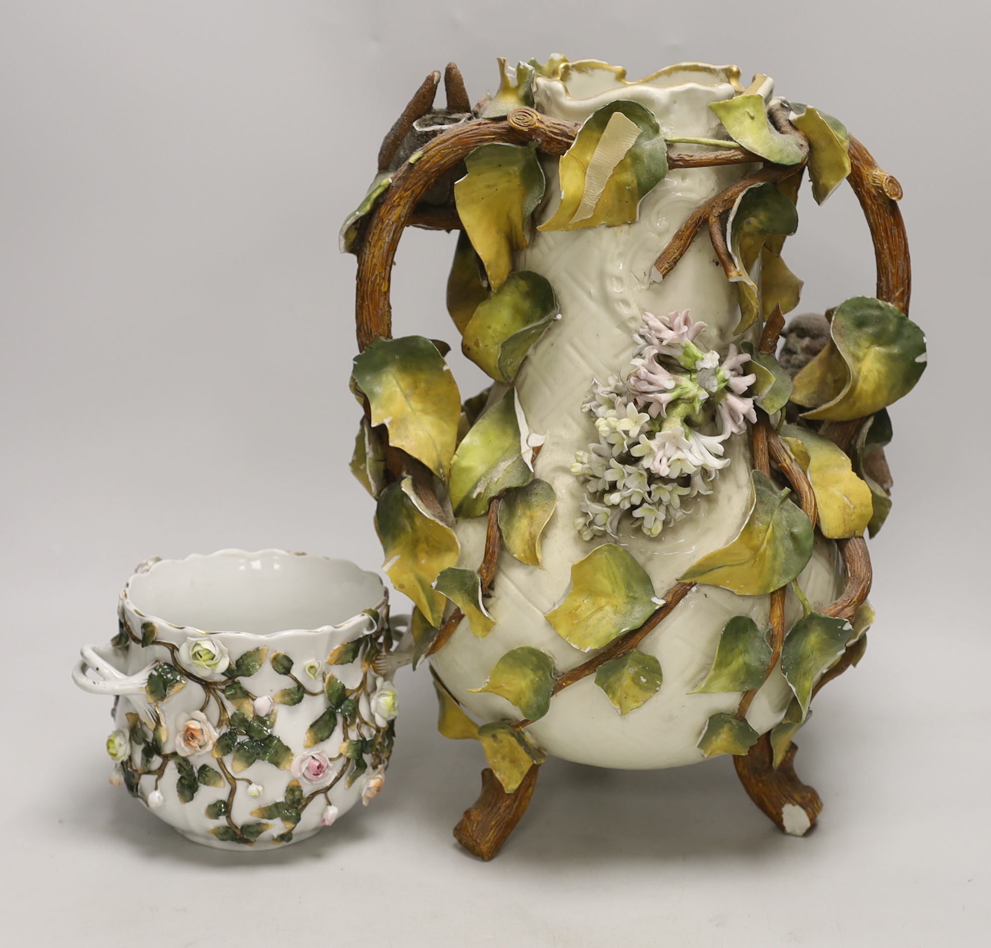 A large Sitzendorf porcelain vase modelled with putti and sparrows and a similar flower encrusted bowl, vase 37cm (2)
